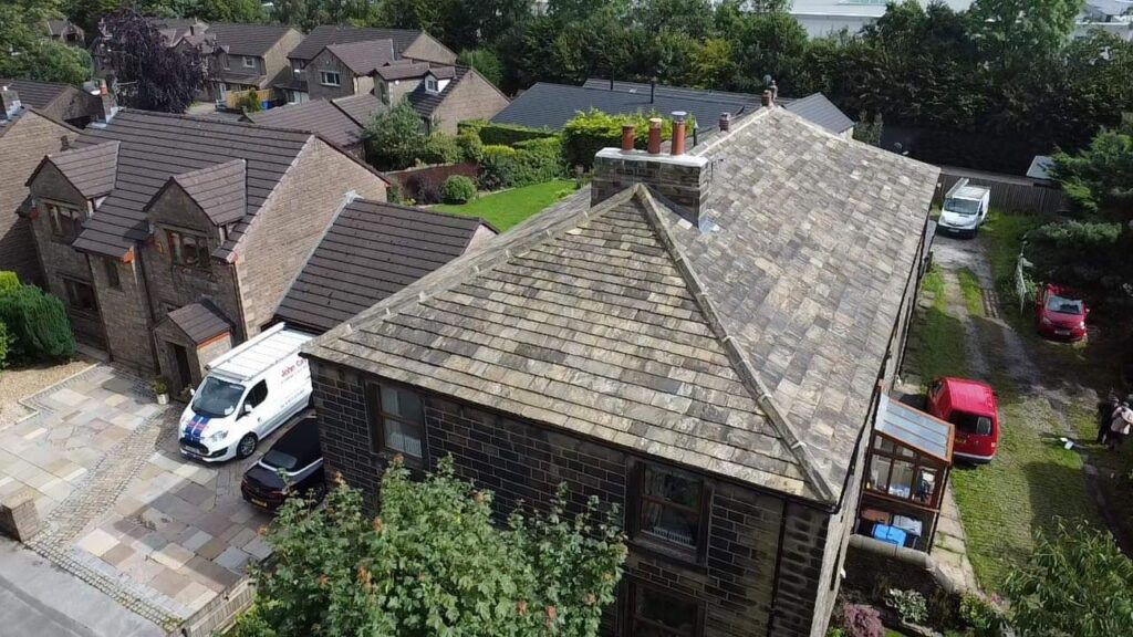 Aerial view of a stone roof on a residential building.