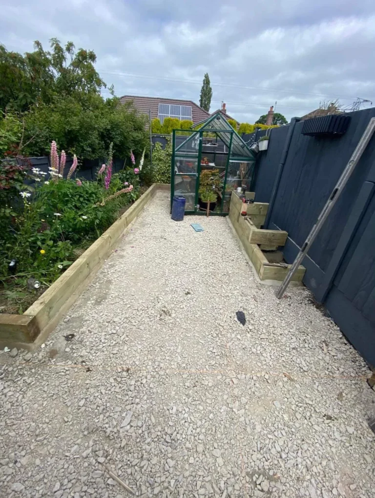Indian Flagstone Patio Installation with Raised Flower Beds